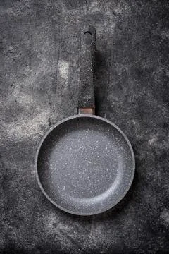 Empty grey stone frying pan Stock Photos