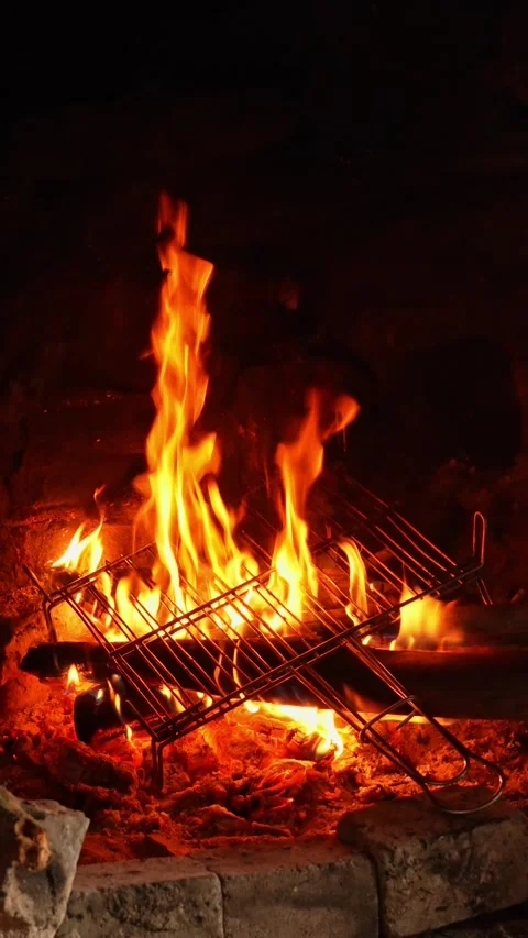 Empty grill grate heating over burning coals Stock Footage 324665095