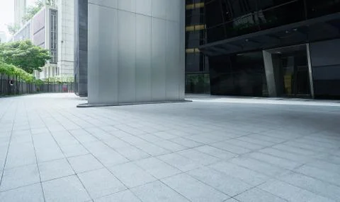 Empty ground in front of modern buildings . Stock Photos