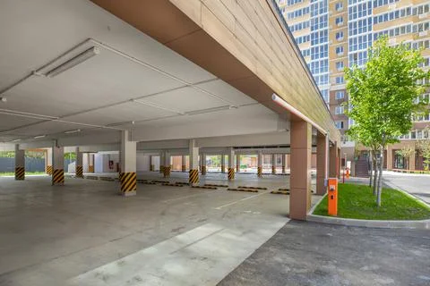 Empty ground parking in the yard of a modern house. Stock Photos