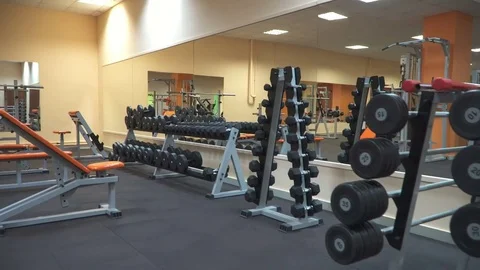Empty gym with equipment and free weights Stock Footage