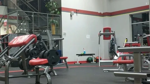 Empty Gym with Exercise Equipment and Weights Stock Footage 83467996