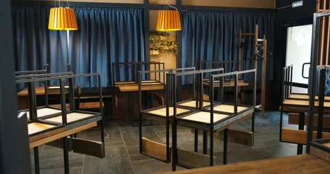 Empty hall of closed restaurant, cafe. Quarantine due to coronavirus pandemic. Stock Footage 136075109