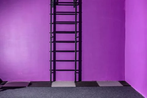 Empty hall dance hall with clock on the wall and ballet bench for training Stock Photos