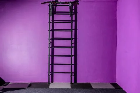 Empty hall dance hall with clock on the wall and ballet bench for training Stock Photos