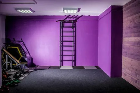 Empty hall dance hall with clock on the wall and ballet bench for training Stock Photos