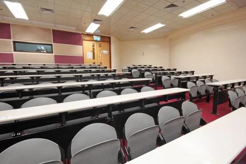 Empty hall for presentation with grey armchairs Stock Photos