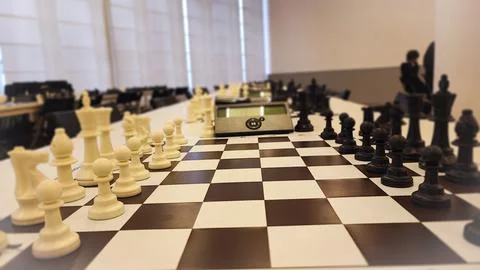 An empty hall with tables on which chess boards and timers are prepared. Co.. Stock Photos