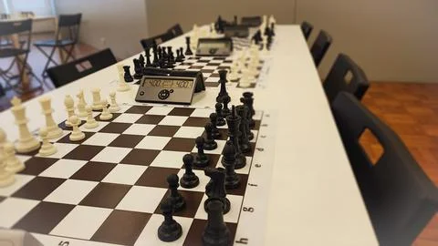 An empty hall with tables on which chess boards and timers are prepared. Co.. Stock Photos