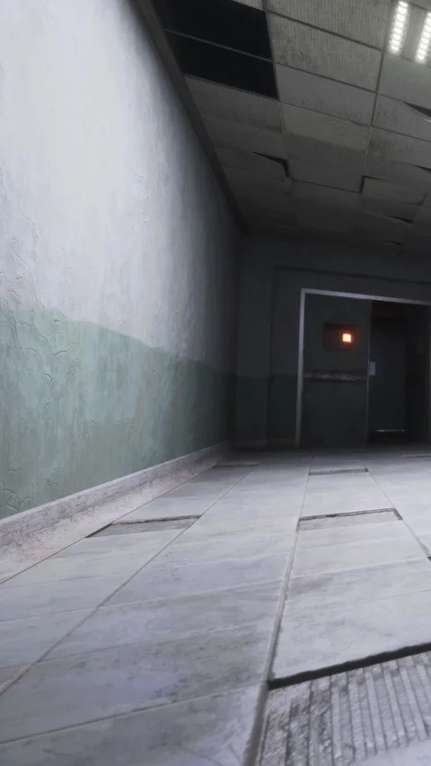 Empty hallway in a building with a muted color scheme and fluorescent lights Stock Footage 338003872