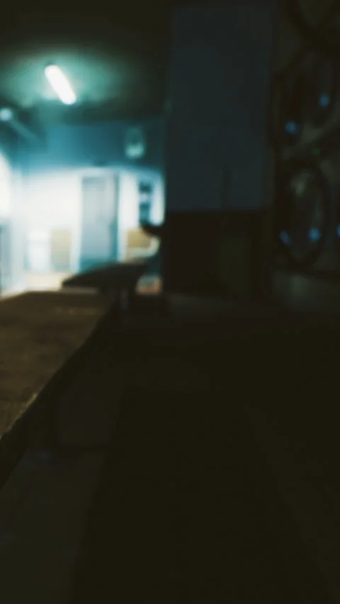 Empty hallway in a dimly lit building at night with a bench in focus Vídeos de archivo 331369681