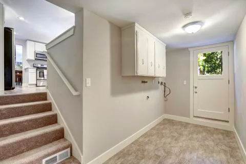Empty hallway with exit to backyard area Stock Photos