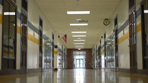 Empty hallway in high, middle, or elementary school with all the lights on. Video stock 167458616