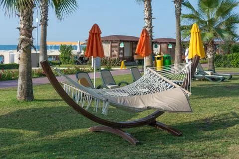 Empty hammock on green meadow Stock Photos