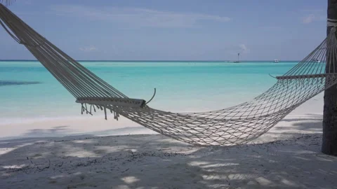 Empty Hammock Overlooking Turquoise Water on a Maldives Beach Stock Footage 340707003