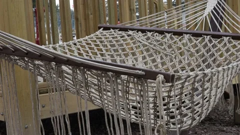 An empty hammock swinging in the garden Stock Footage 171774432