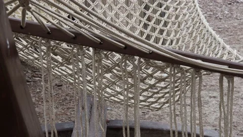 An empty hammock swinging in the garden Stock Footage 171789293