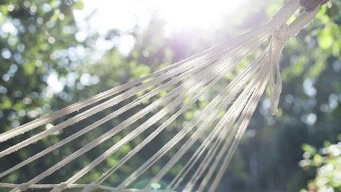 An empty hammock swings in the wind. Stock Footage 81322400