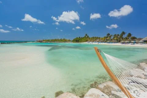 Empty hammock on tropical beach Stock Photos