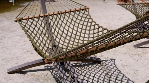 Empty hammock by the water Stock Footage 293215392