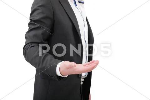 An empty hand of a businessman in black suit Stock Photos