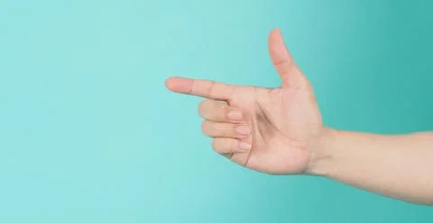 Empty Hand holding or catch nothing guesture on green and blue or mint backgr Stock Photos