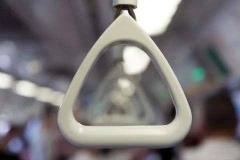 Empty handle in subway train Photos