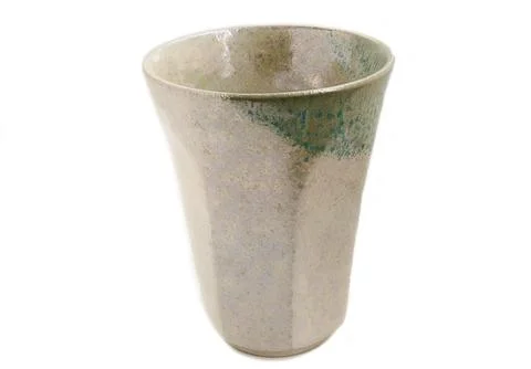 Empty handmade ceramic cup, antique tea cup on a white background.  Foto stock