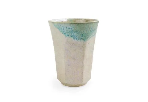 Empty handmade ceramic cup, antique tea cup on a white background.  Stock Photos
