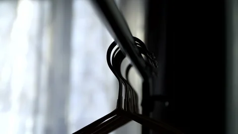 An empty hanger in a small apartment on the background of a window Stock Footage 155243950
