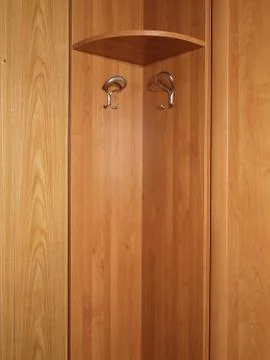 Empty hanger with two metal coat hooks. Stock-Fotos