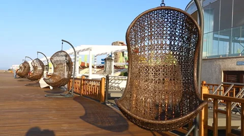 Empty hanging wicker chair aqua park in Baku, Azerbaijan 스톡 동영상 63615423