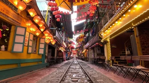 Empty Hanoi Train Street with railway tracks running through lively cafes. Stock-Footage 317751760