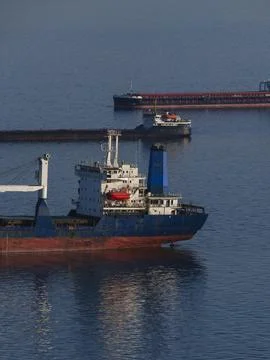 Empty heavy cargo ships anchored in coastal waters Stock-Fotos