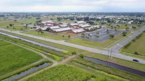 Empty High School Campus Due to Coronavirus aerial wide approach and parking Video stock 128673694