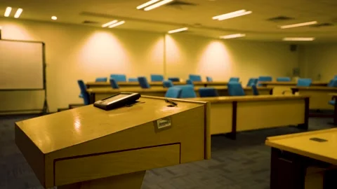 An empty high school classroom with rows of vacant desks and chairs in Karachi Stock Footage 333681509
