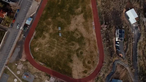 Empty high school track field no students Football soccer Aerial drone footage Vídeo Stock 128453505