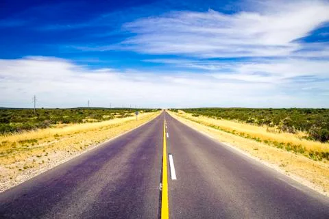 Empty highway landscape on the way to the end of the world. Stock Photos