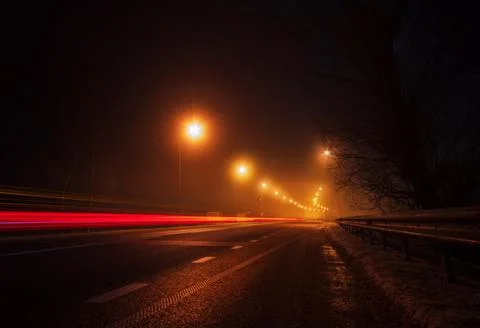 Empty highway with light trails. Stock Photos