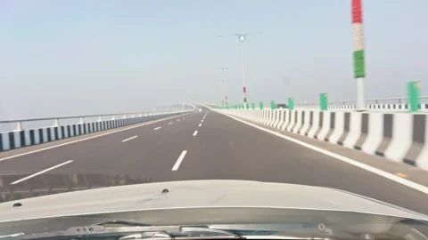 On a Empty highway running a car viewed from a cars dashboard on a clear da.. Stock Footage 265838028