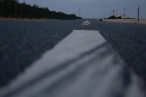 Empty highway with trees in farm Foto stock