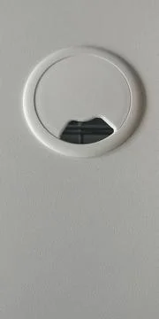 Empty hole for electric wire and cable on computer desk. Without wires Stock Photos