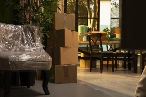 Empty home interior with stacks of cardboard boxes after moving in Stock Photos