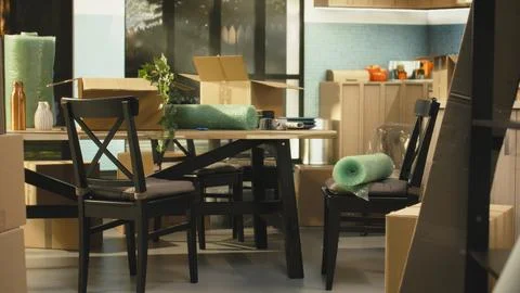Empty home interior with stacks of cardboard boxes after moving in Stock Photos