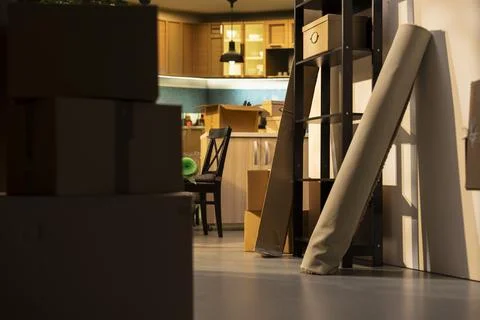 Empty home, stacked boxes, for moving in concept, furniture and belongings Stock Photos