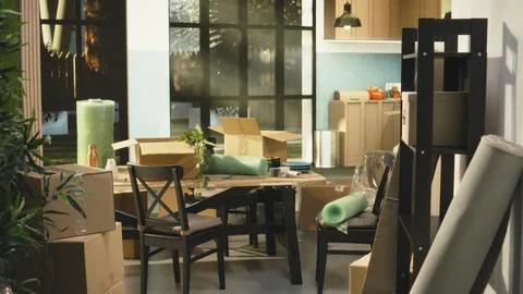 Empty home, stacked boxes, for moving in concept, furniture and belongings Stock Photos