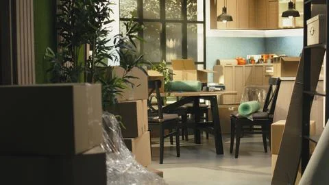 Empty home, stacked boxes, for moving in concept, furniture and belongings Stock Photos