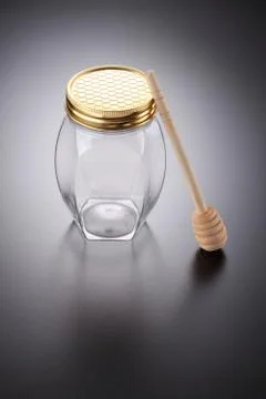 Empty honey jar Stock Photos