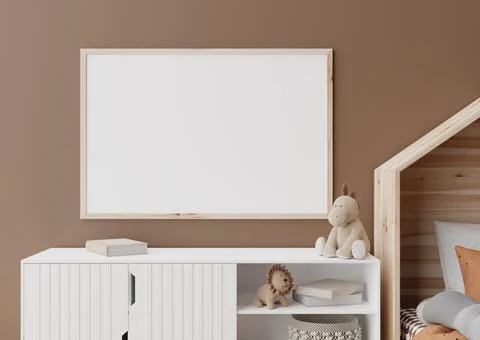 Empty horizontal picture frame on brown wall in modern child room. Mock up in Stock Photos