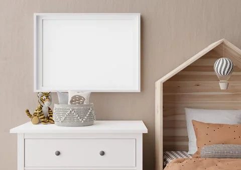Empty horizontal picture frame on brown wall in modern child room. Mock up in Stock Photos